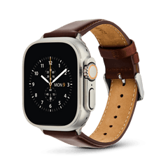 An Apple Watch Ultra with a titanium case, fitted with a Daniel Wellington St Mawes brown leather strap and silver pin buckle.