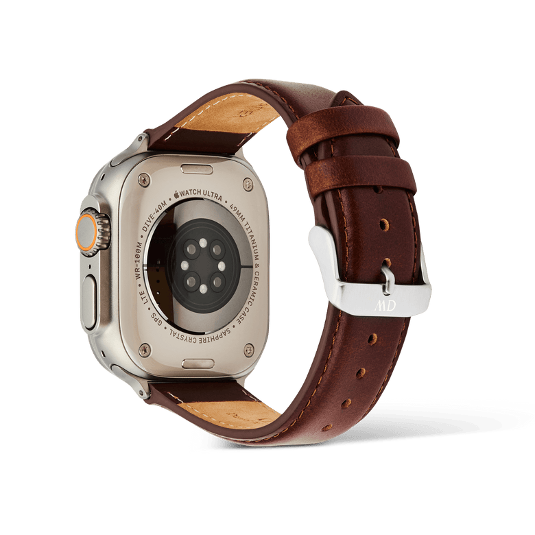 Daniel Wellington St Mawes Leather Strap in brown, shown on the back of an Apple Watch Ultra with a silver pin buckle.