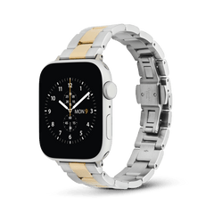 Daniel Wellington's Iconic Link smartwatch strap in two-tone silver and gold, featuring a three-piece link design on an Apple Watch.